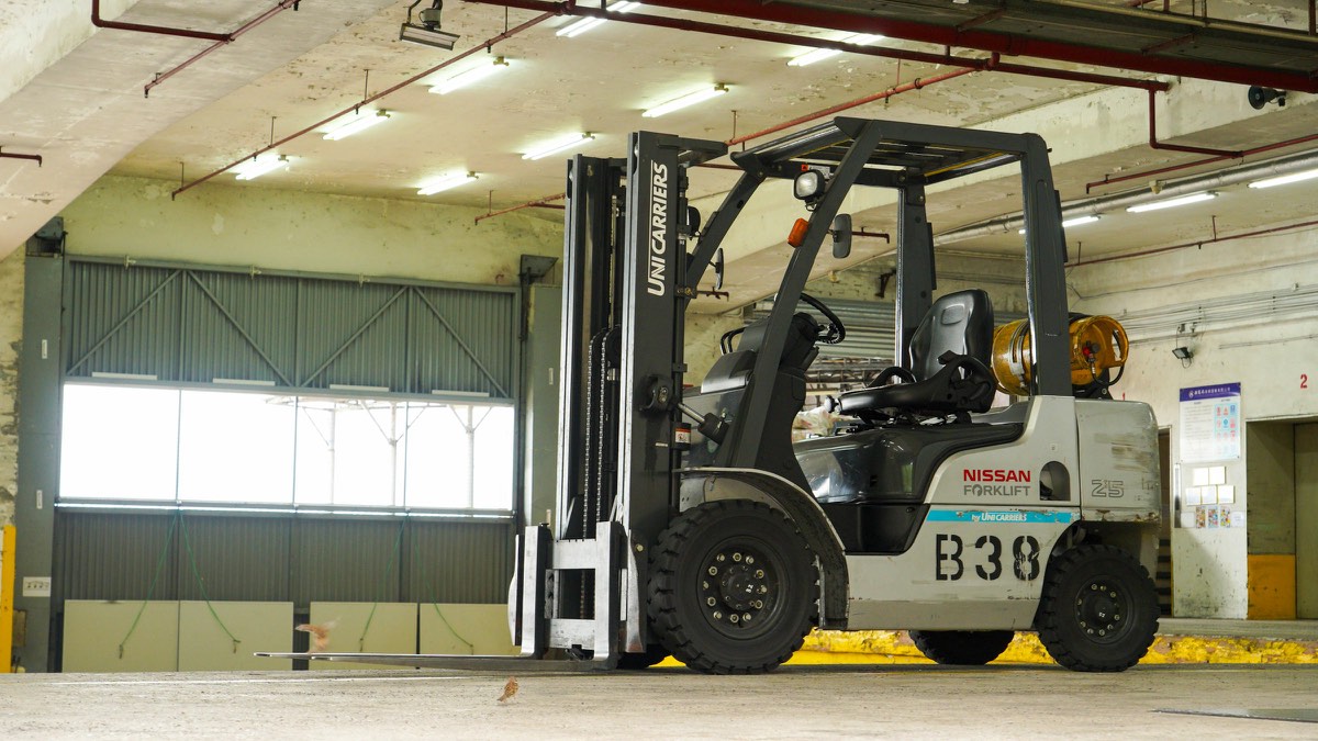 A forklift parked inside a warehouse